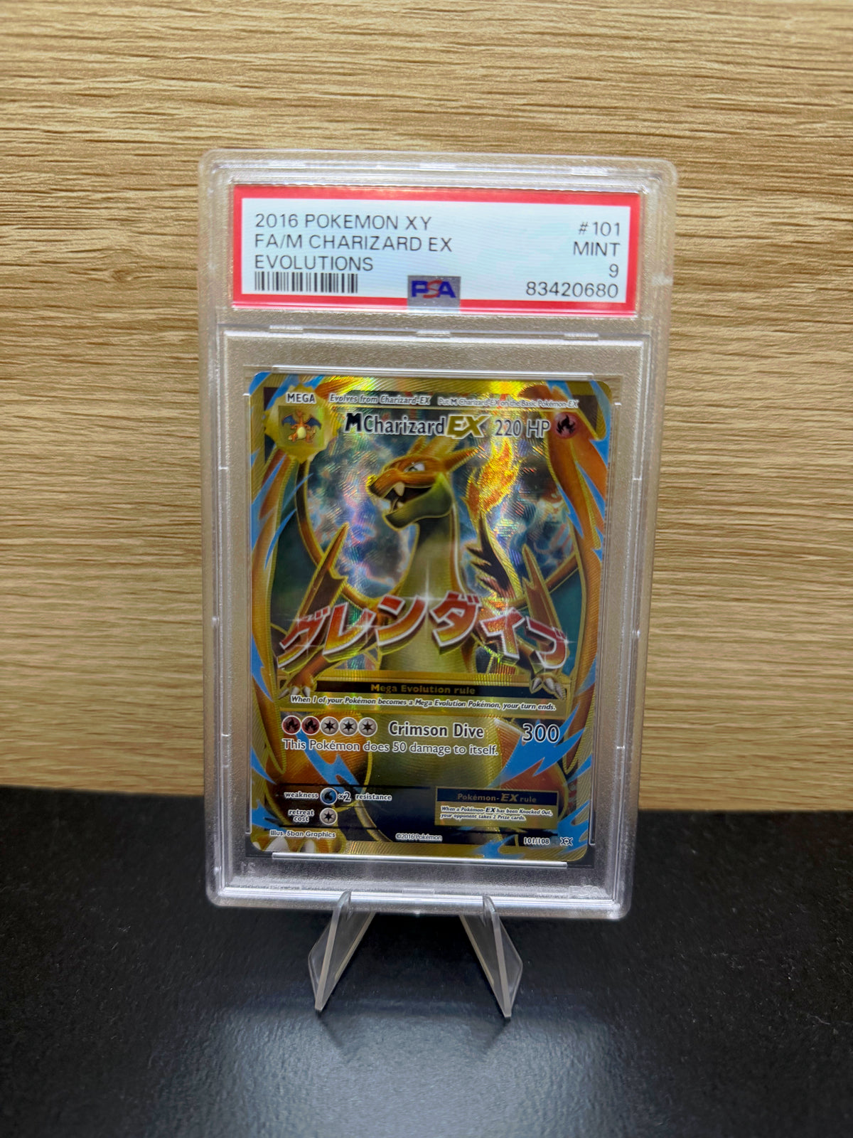 M Charizard EX Evolutions #101 in PSA 9 slab