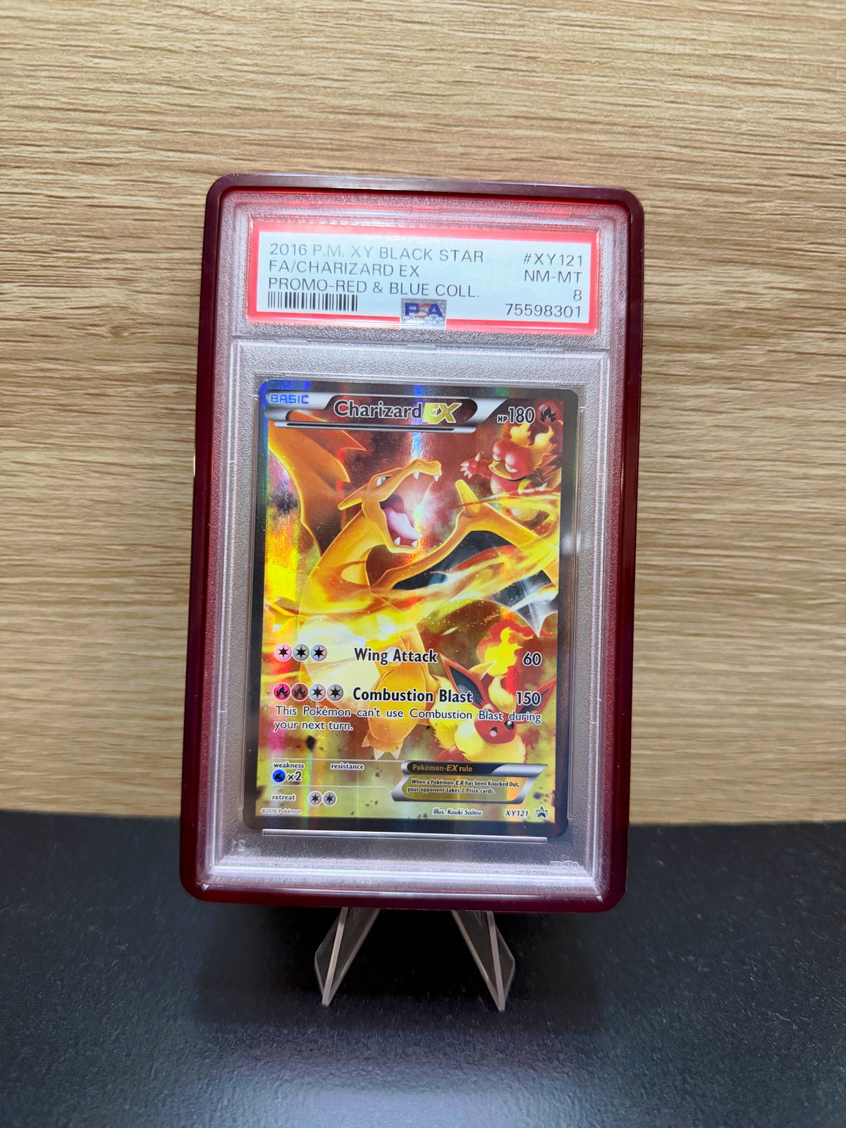 Charizard EX Pokémon card in a PSA slab