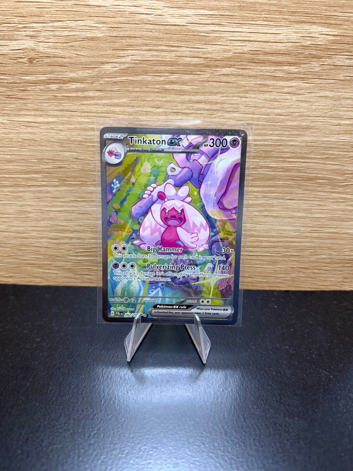 English Tinkaton ex Pokémon card displayed on a stand