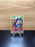 English Piplup Pokémon card displayed on a stand