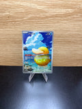 English Psyduck Pokémon card displayed on a stand