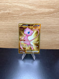 English Mew ex Pokémon card with gold artwork displayed on a stand